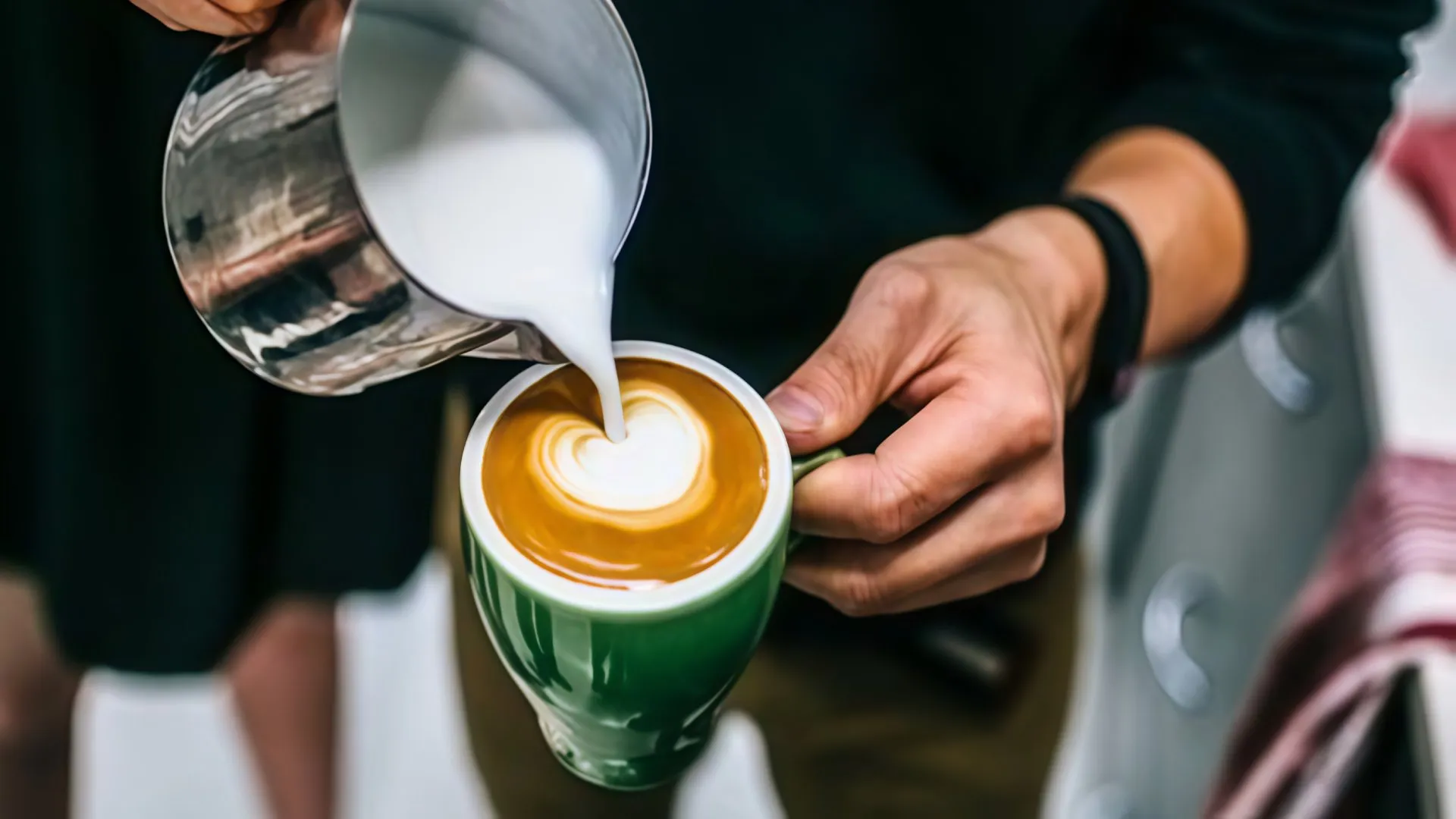 Cup of Colombian coffee served with heart-shaped latte art-Colombian Gastronomy