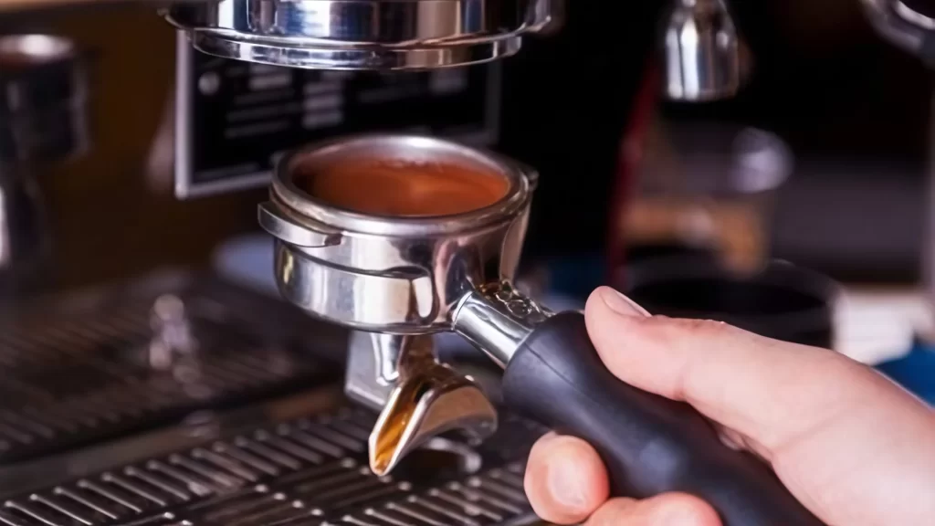 Barista extracts an espresso with a professional coffee machine-Colombian Coffee
