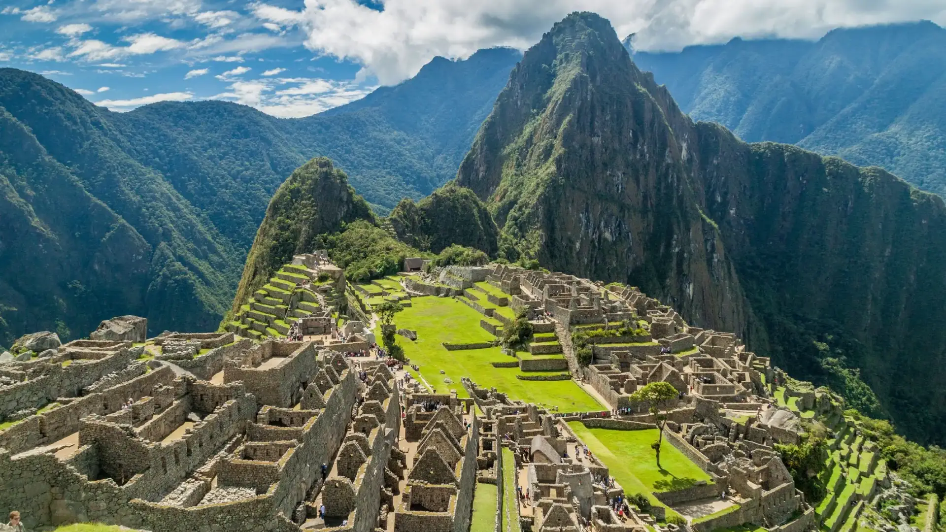 Inca citadel of Machu Picchu surrounded by green mountains-cultural travel Peru